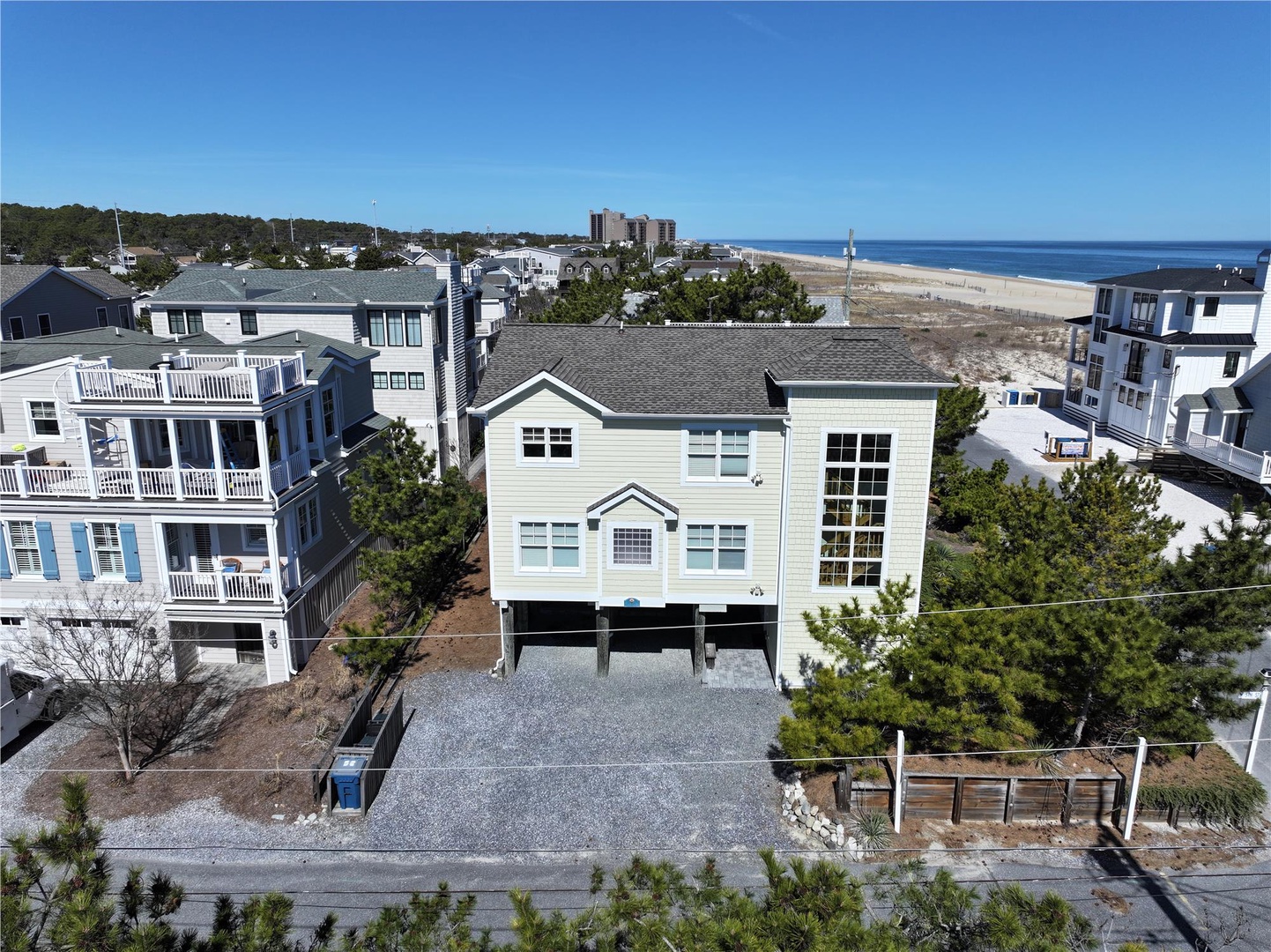 Elevated beach house positioned just moments from pristine sandy shores and sparkling ocean waters.