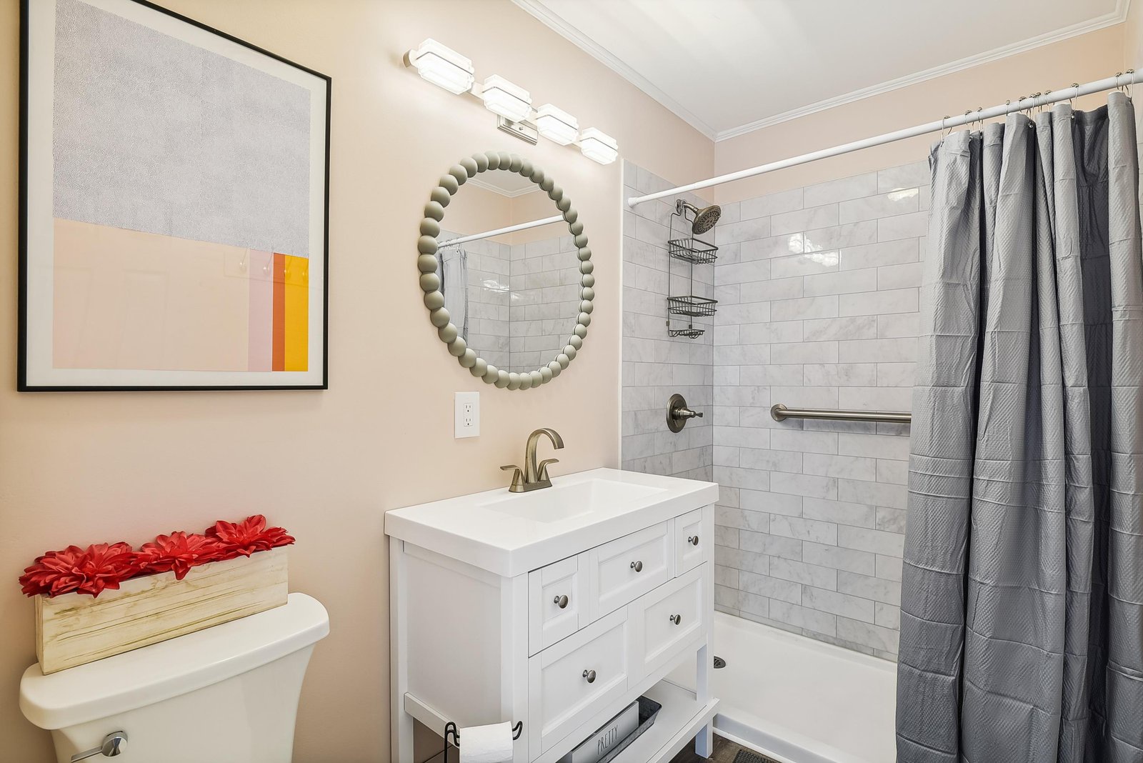Step into your thoughtfully designed bathroom featuring bright subway tile, a sleek vanity, and accessibility-friendly grab bars. Fresh towels and modern lighting set the tone for your daily routine.