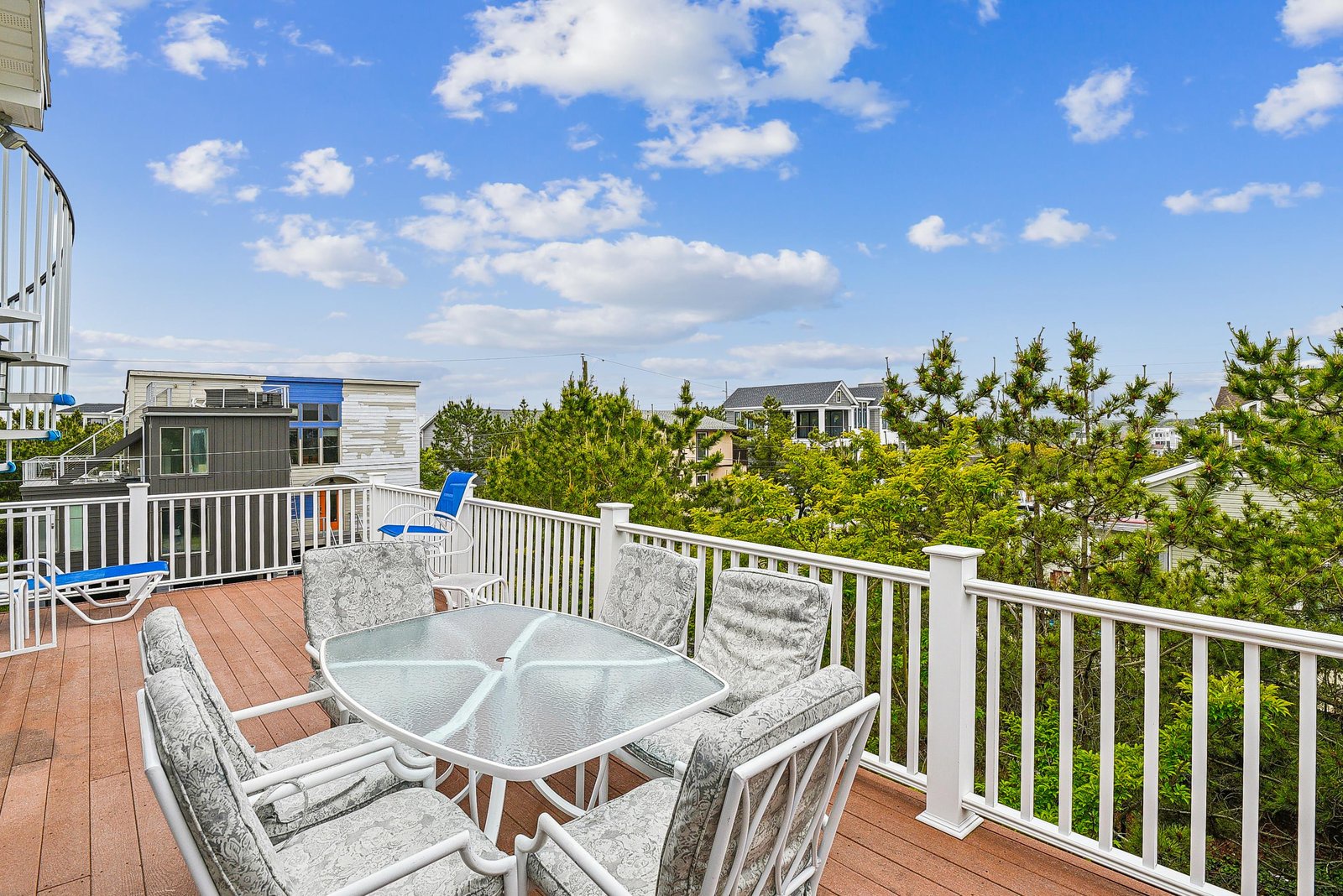 Sip your morning coffee on your private deck, where lush greenery and blue skies frame every moment. The perfect spot to unwind and soak in the peaceful coastal surroundings.