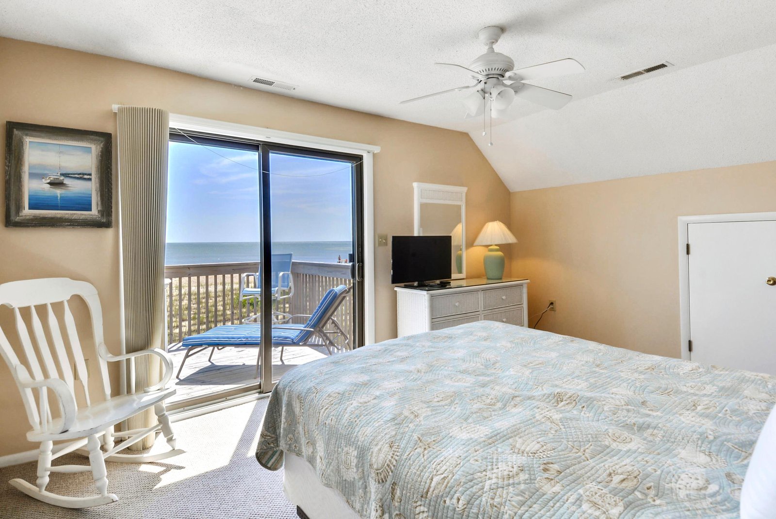 Wake up to tranquil ocean views right from your bed. This peaceful bedroom opens to your private deck where sea breezes and coastal calm are always within reach.