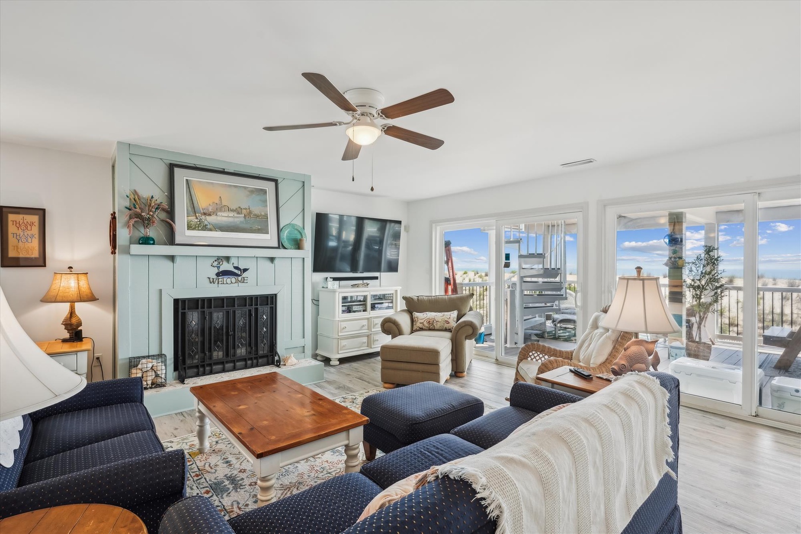 Unwind in your coastal-inspired living room, where nautical touches, a cozy fireplace, and ceiling fan create the perfect retreat. Step through sliding glass doors to your private balcony and enjoy stunning ocean views.