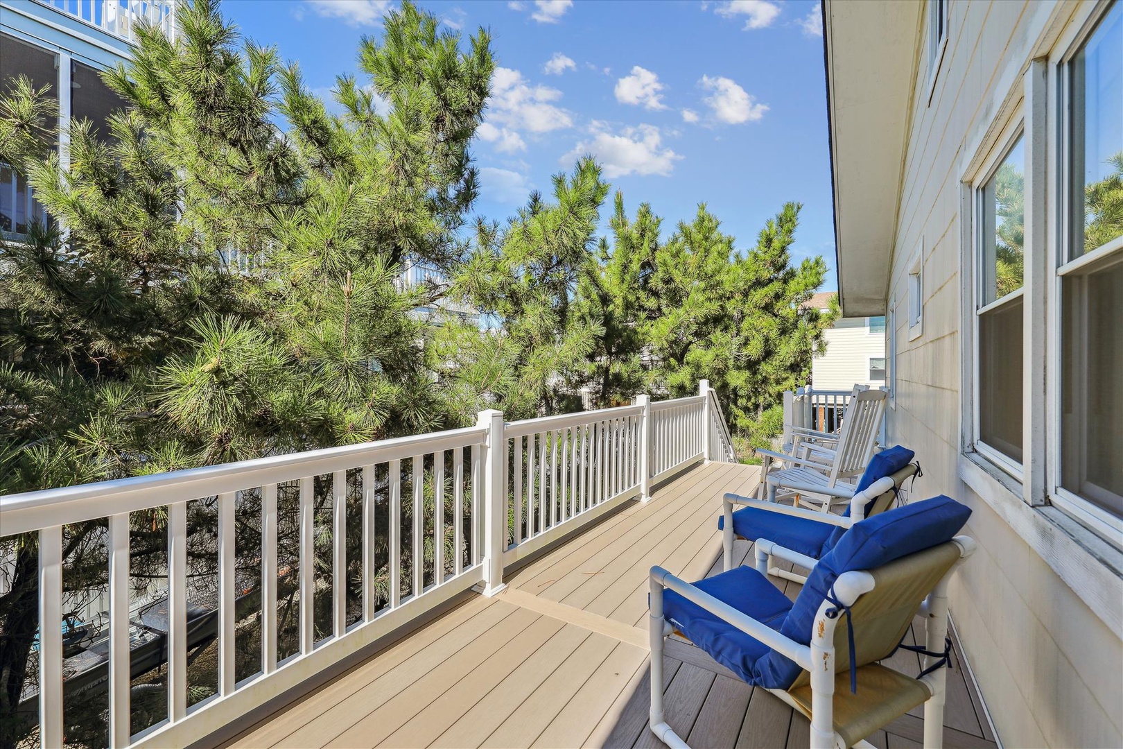 Picture yourself lounging on this private deck with a good book, surrounded by towering pines and fresh coastal air. Your personal outdoor retreat awaits just steps from your door.