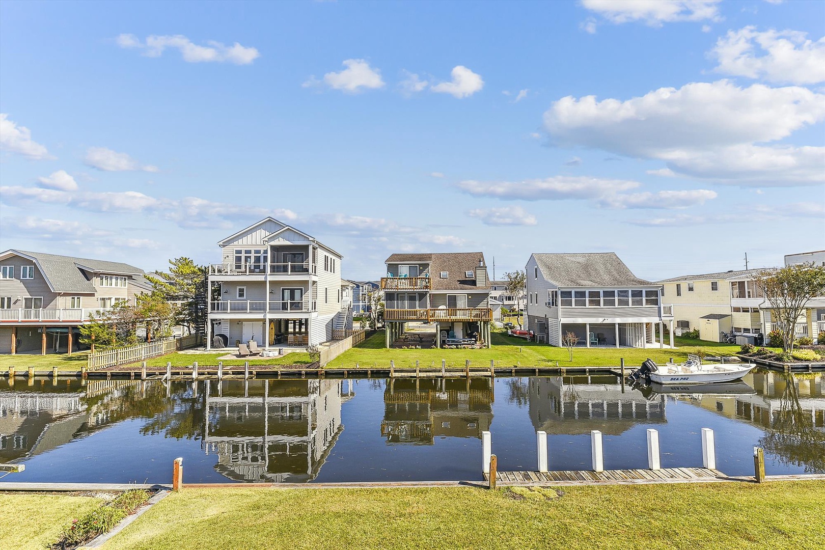 Waterfront property located in a peaceful canal neighborhood with private boat docking, surrounded by well-maintained homes and scenic views.