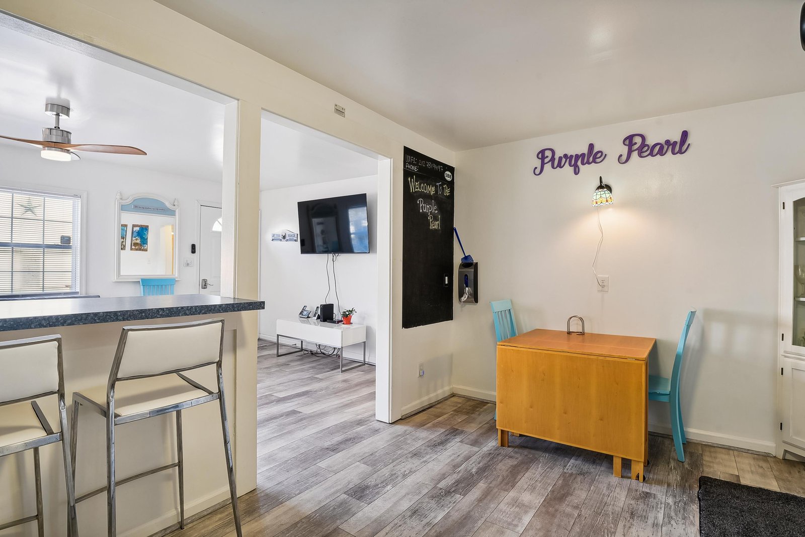 Step into your bright and welcoming retreat, where charming touches like the friendly 'Purple Pearl' greeting make you feel right at home from the moment you arrive.