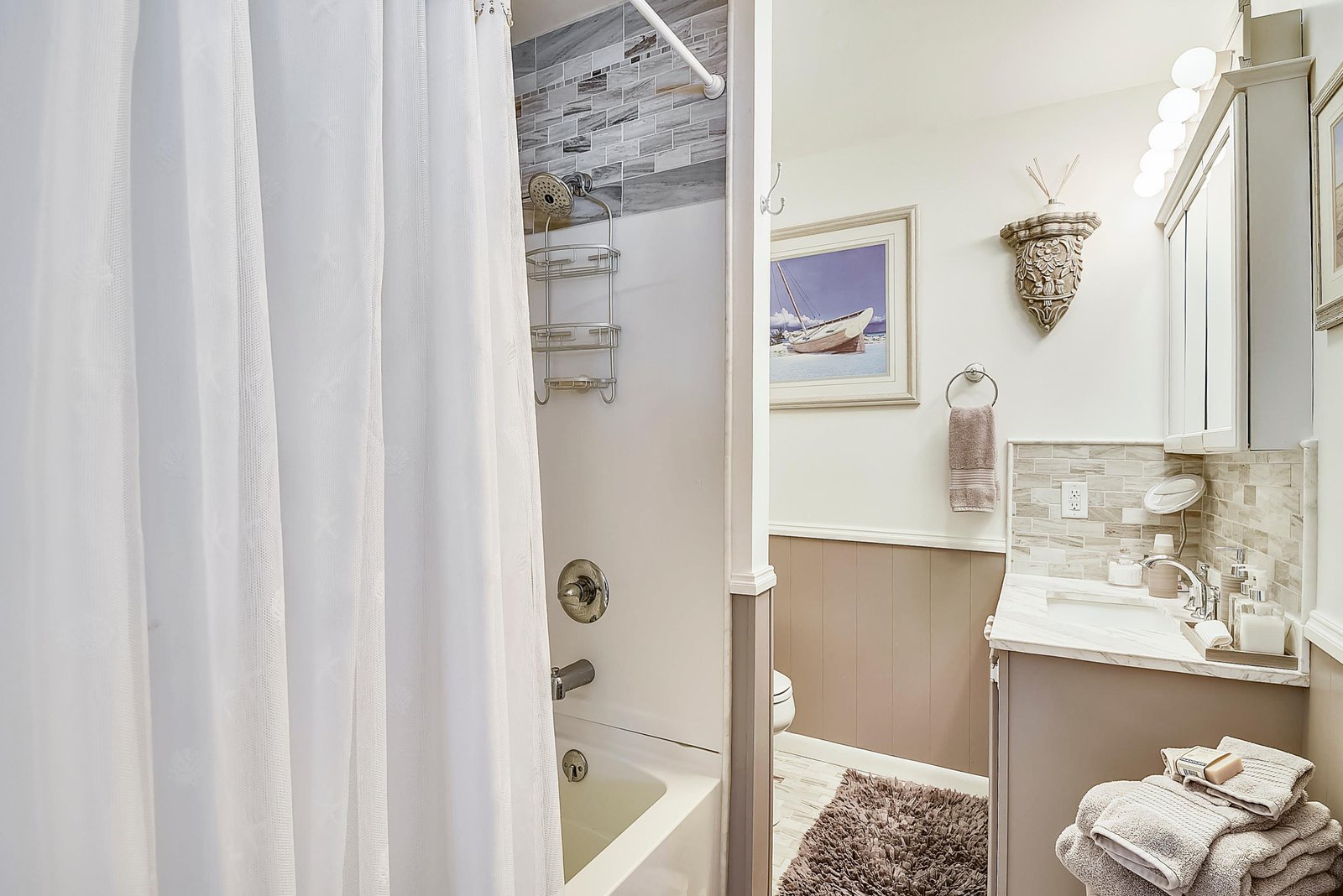 Step into your private coastal retreat, where soft nautical tones and beach-inspired accents create a soothing atmosphere after a day of adventure.