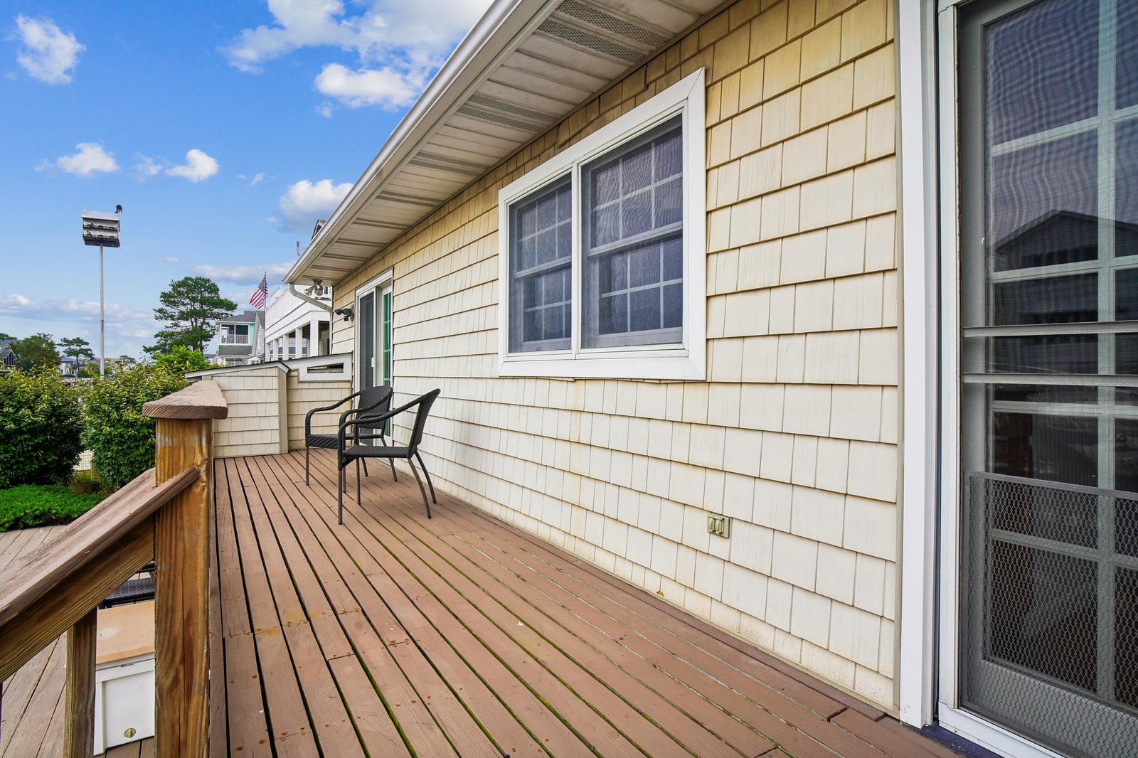 Step out onto your private deck and take in the fresh coastal air. With a comfortable chair waiting, this is your perfect spot to sip morning coffee or watch the sunset over the neighborhood.