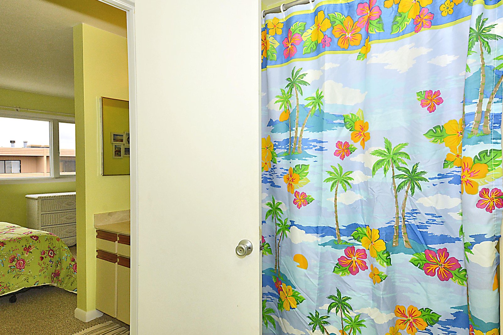 Your sunny getaway awaits with cheerful tropical touches like this vibrant shower curtain, bringing island vibes and endless vacation smiles to your stay.