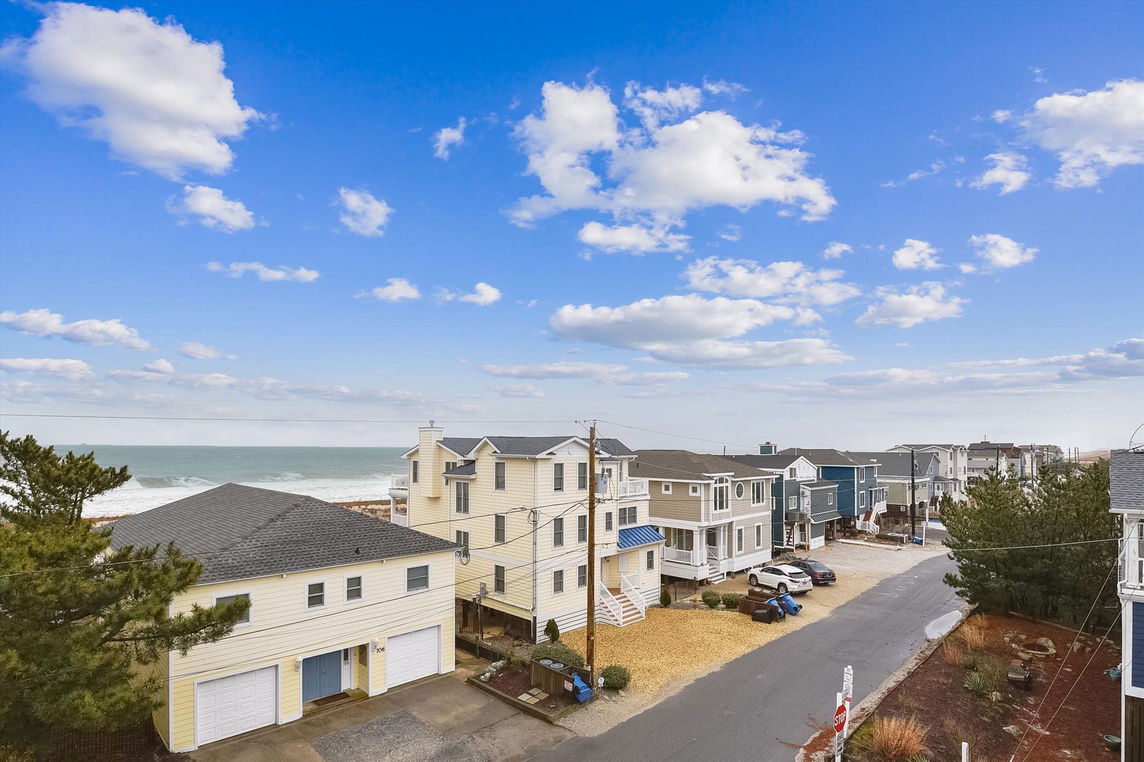 Coastal neighborhood featuring beach houses near the shoreline, with ocean views and easy access to the waterfront area.