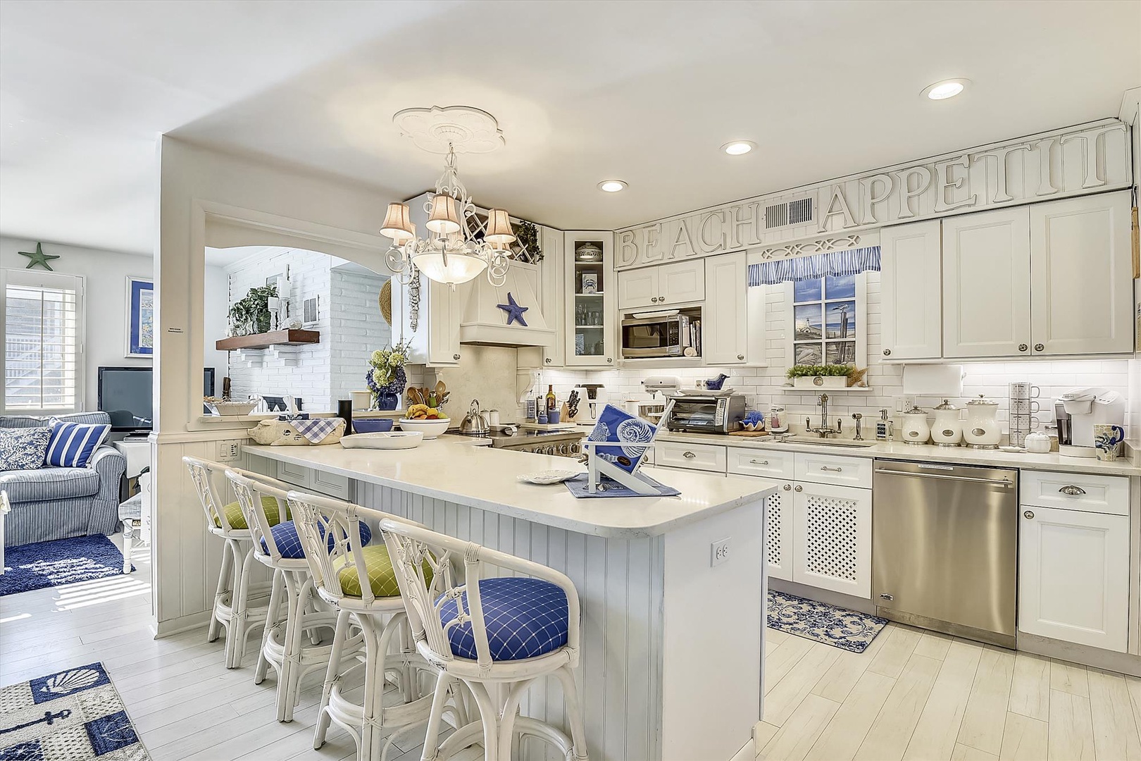 Gather around this spacious kitchen island where you can prep meals together, share stories over breakfast, and soak in the coastal charm of your beach retreat.
