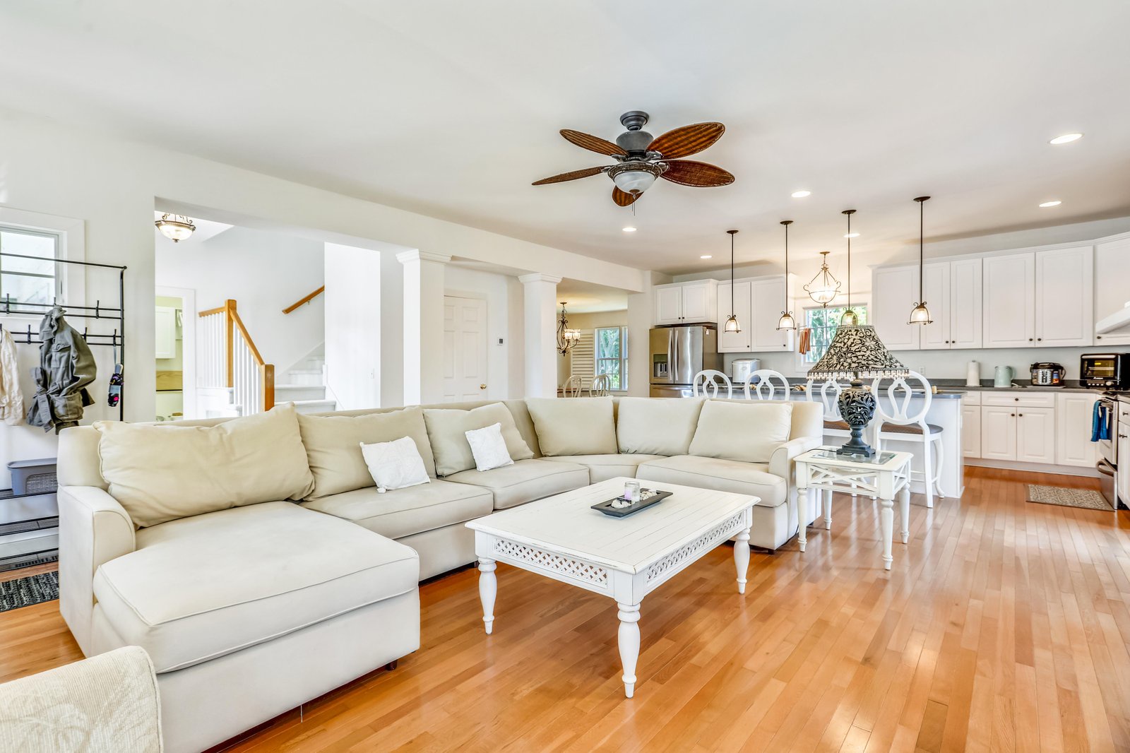 Relax into an open, airy space where your living room flows effortlessly into the kitchen—perfect for gathering, cooking, and sharing stories over a meal.
