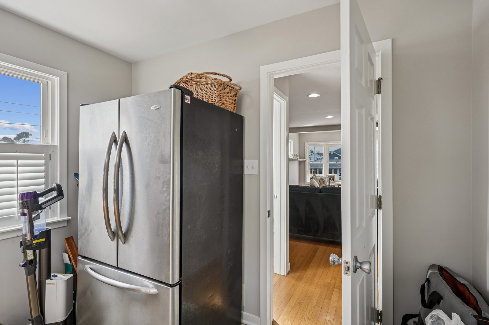 Store your favorite snacks and leftovers in this spacious stainless steel refrigerator, perfectly positioned for easy kitchen access.