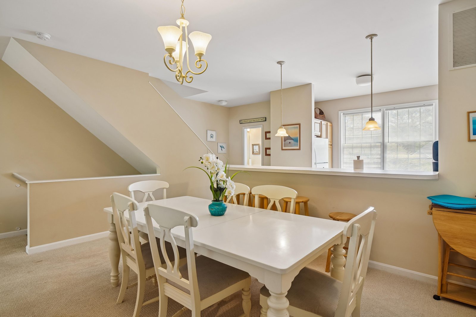 You'll love gathering around this inviting dining table, perfect for sharing meals and making memories with family under warm, welcoming light.