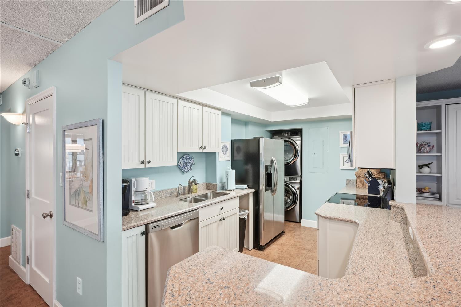 Your fully-equipped kitchen features modern appliances, granite countertops, and a convenient in-unit washer and dryer, making your vacation stay effortless and comfortable.