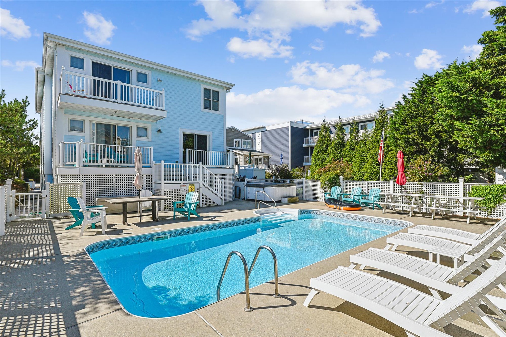 The outdoor pool area offers a refreshing retreat, with colorful loungers and shaded seating waiting for your sunny afternoons.