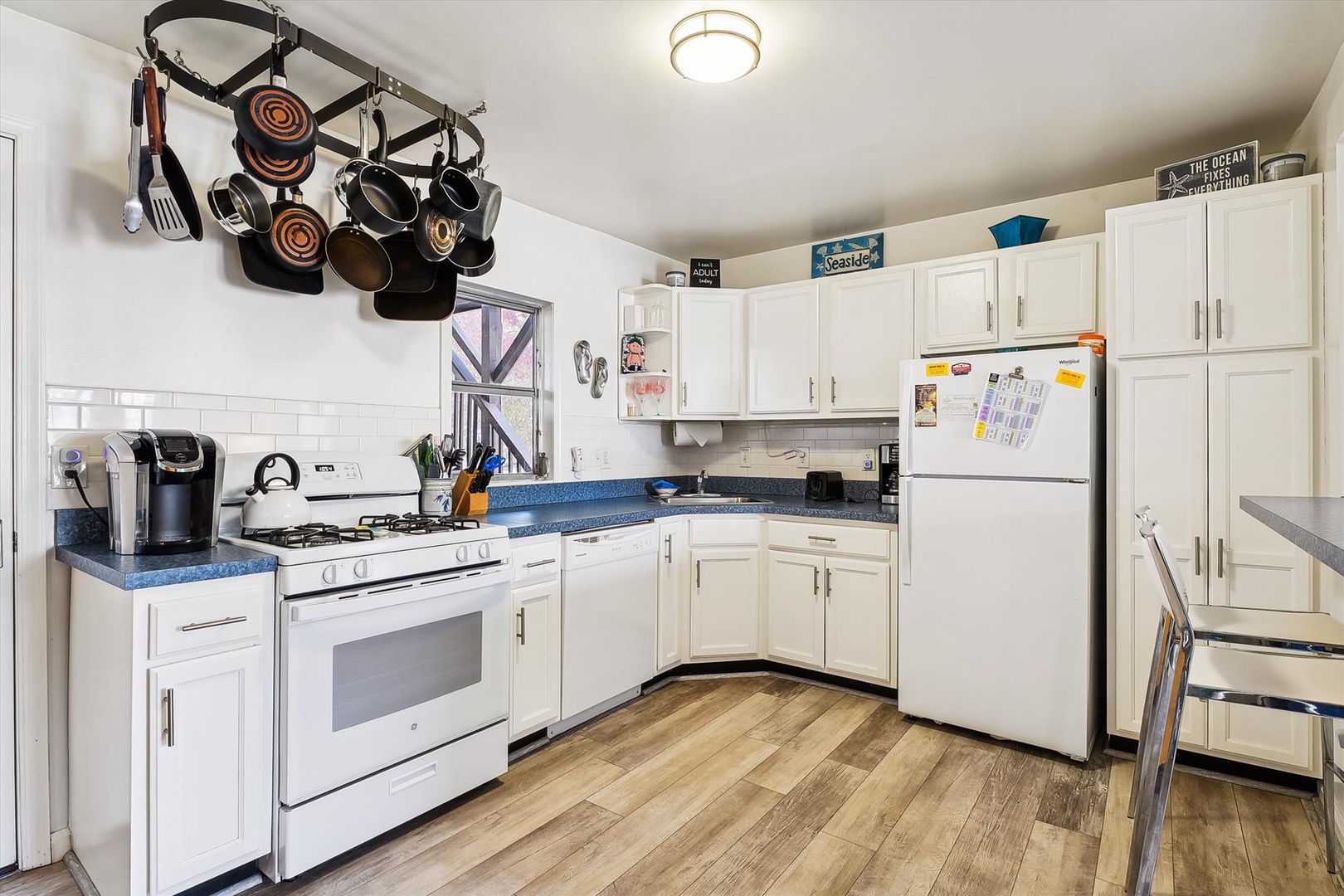 Cook your favorite meals in this bright, fully-equipped kitchen with modern appliances, ample counter space, and everything you need to feel right at home during your stay.