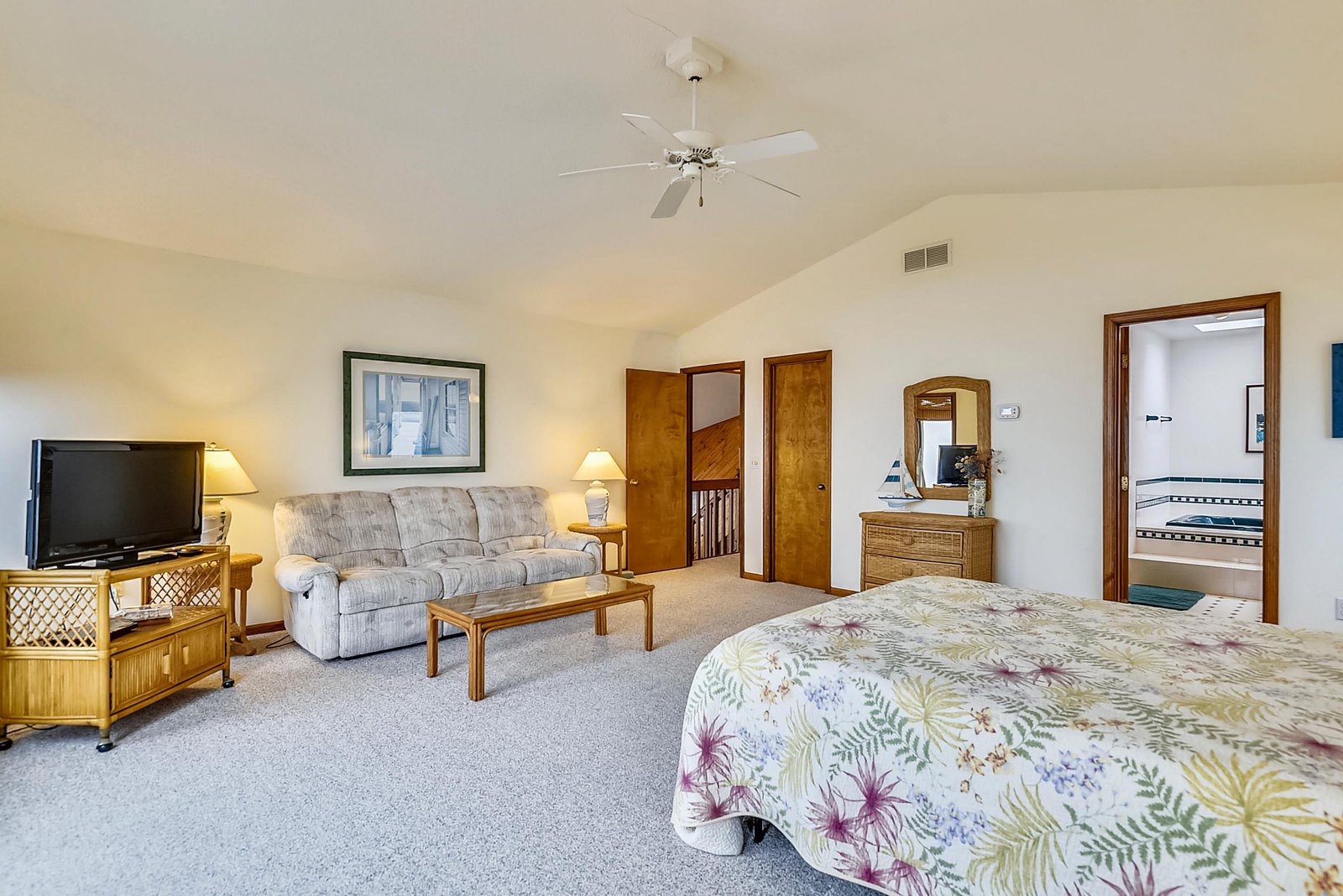 Your spacious suite invites you to unwind with plenty of room to stretch out, relax on the sofa, and enjoy your own private retreat—complete with a cozy bedroom and en-suite bath.