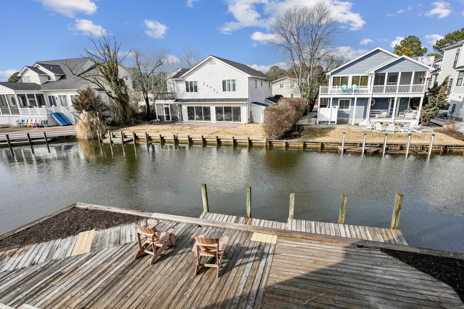 Waterfront community featuring canal access and private dock areas with residential homes.