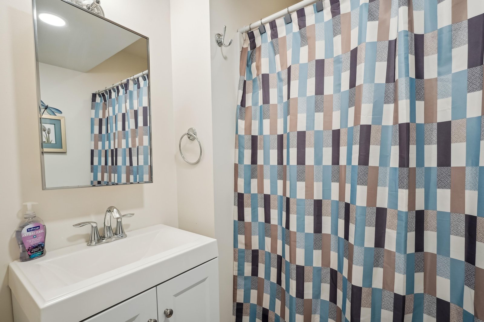 Freshen up in your bright, modern bathroom with a walk-in shower and sleek vanity—everything you need after a day of exploring.