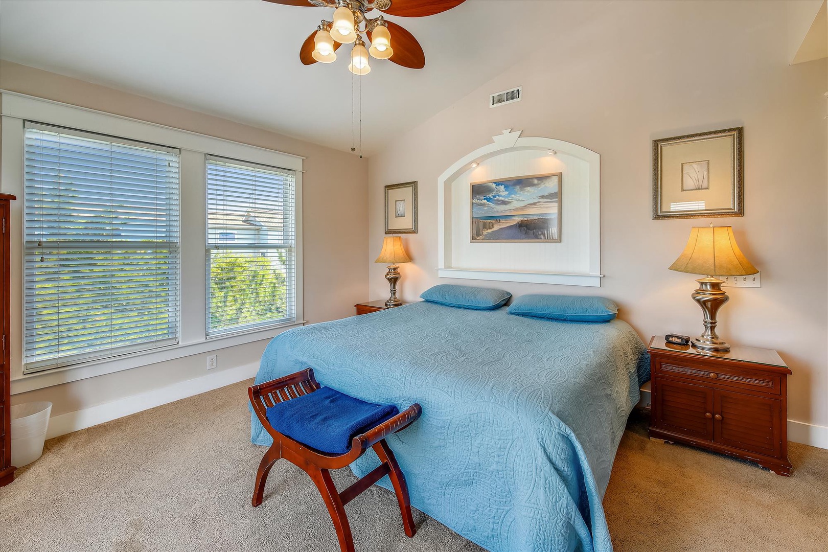 Settle into your serene bedroom, where soft coastal hues, natural light, and thoughtful touches create the perfect retreat after a day of exploring.