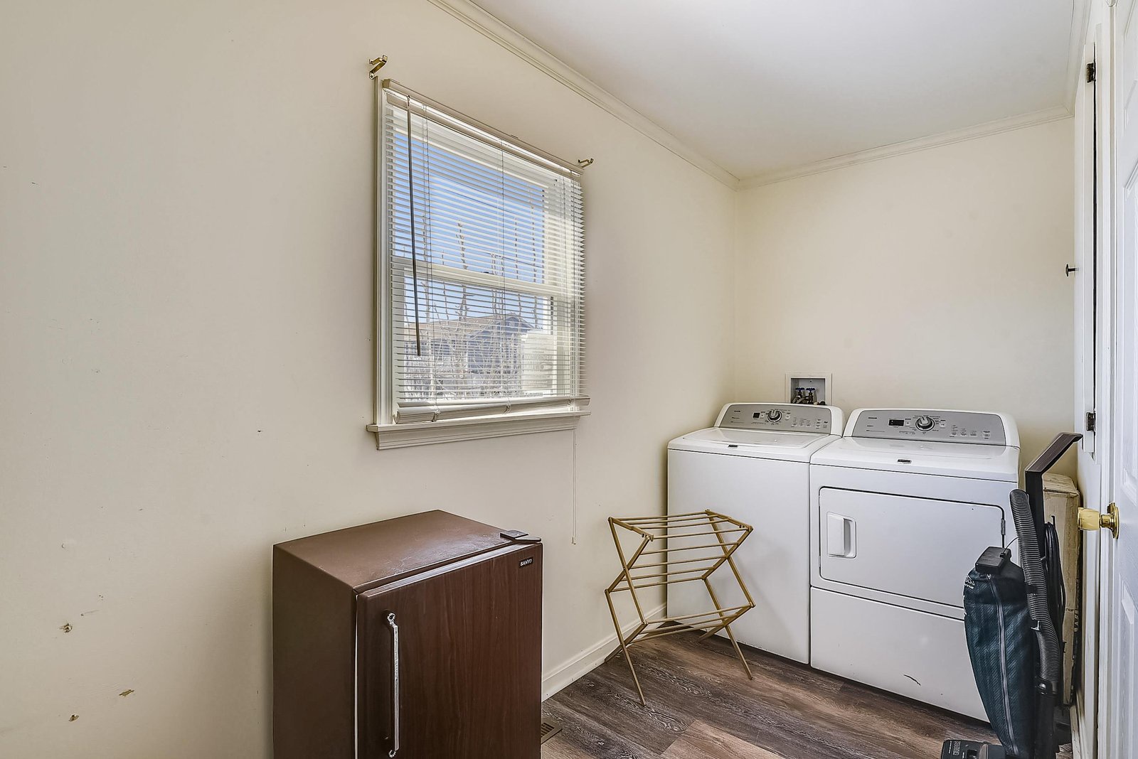Your private laundry room keeps things simple—full-size washer and dryer, natural light, and plenty of space to fold and organize.