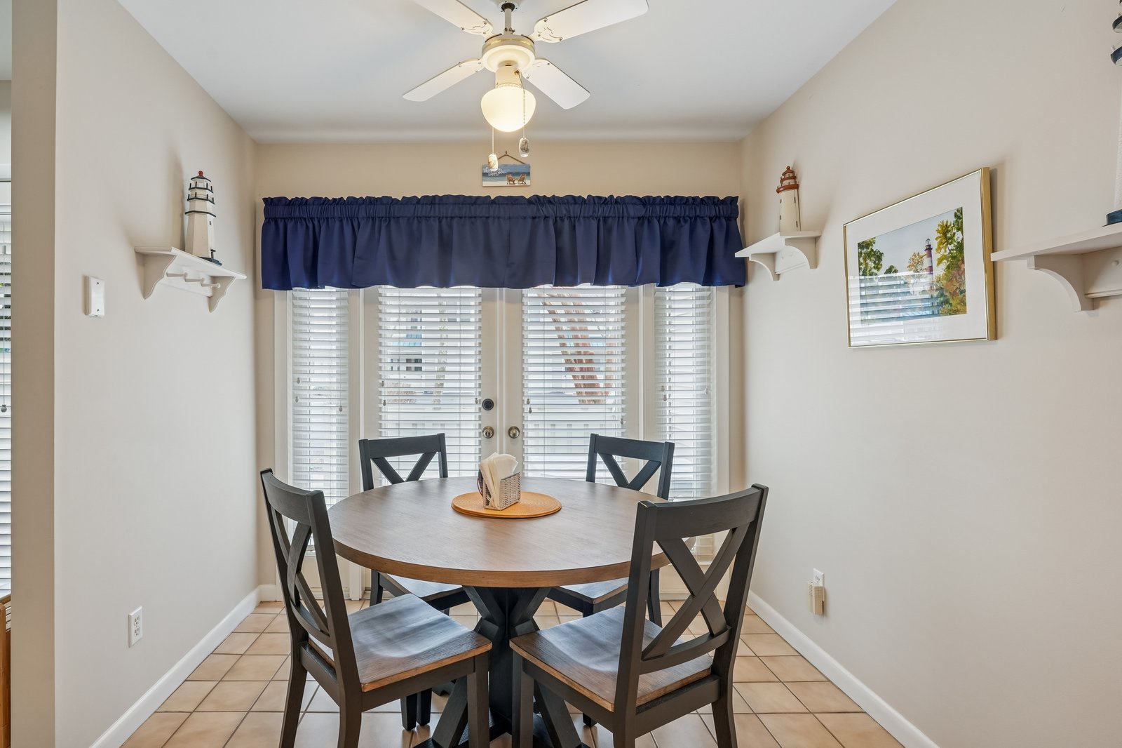 Gather around your charming dining table where coastal touches meet comfort for memorable meals together.