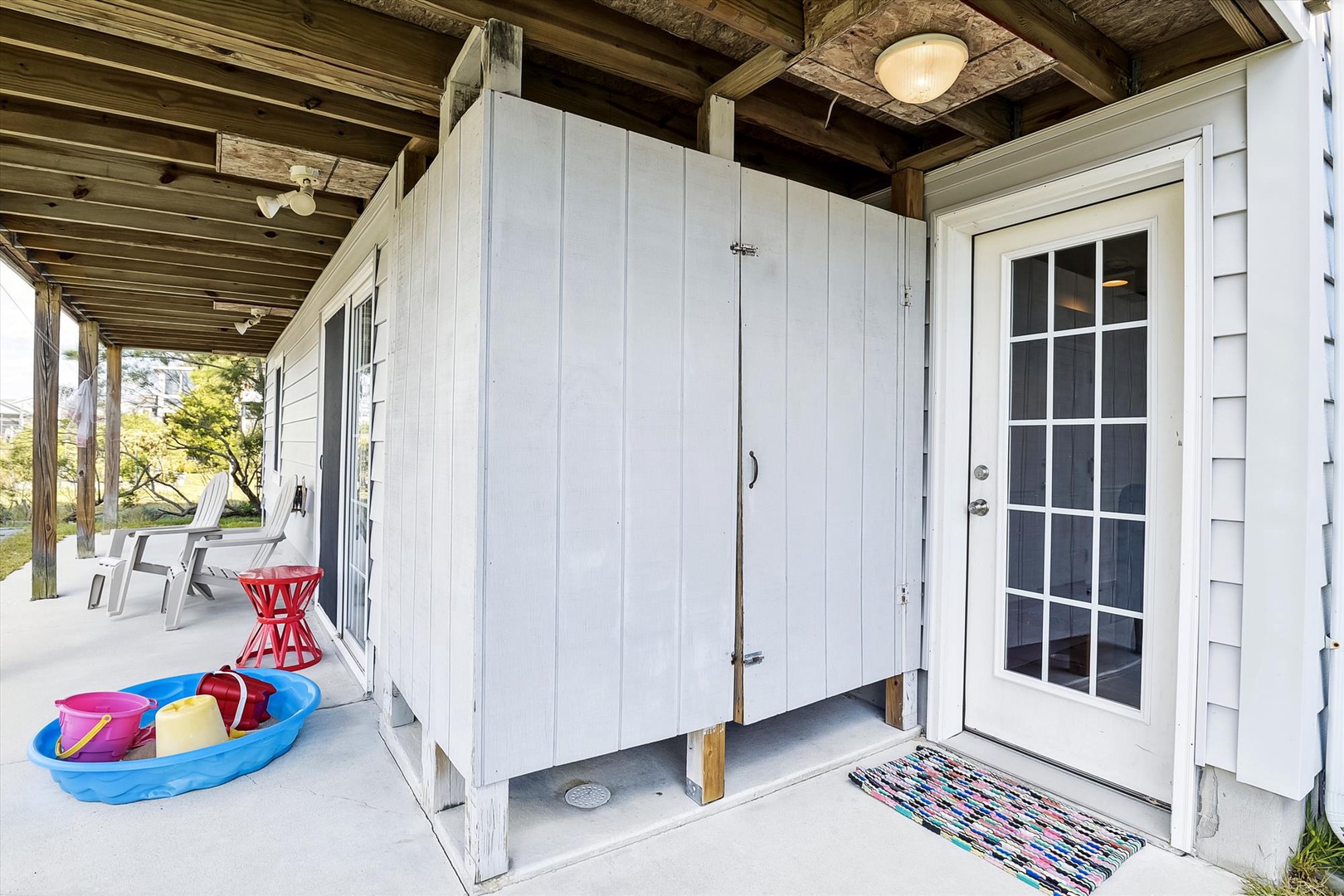 Step out onto the covered patio where you'll find outdoor storage and seating ready for waterfront relaxation.