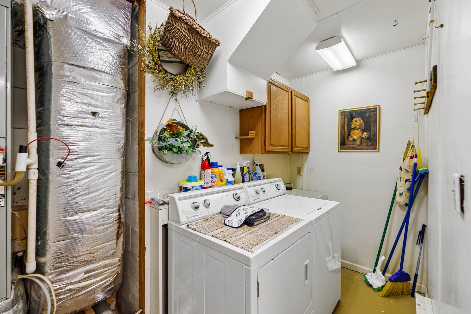 A dedicated laundry room keeps your essentials fresh and ready, with full-sized machines and skylight brightening daily tasks.