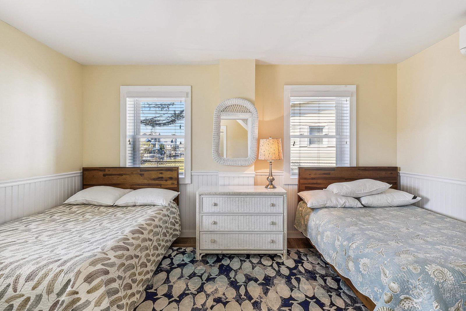 Rest easy in this cozy bedroom with two comfortable beds, soft linens, and coastal charm that invites peaceful sleep after a day of adventure.