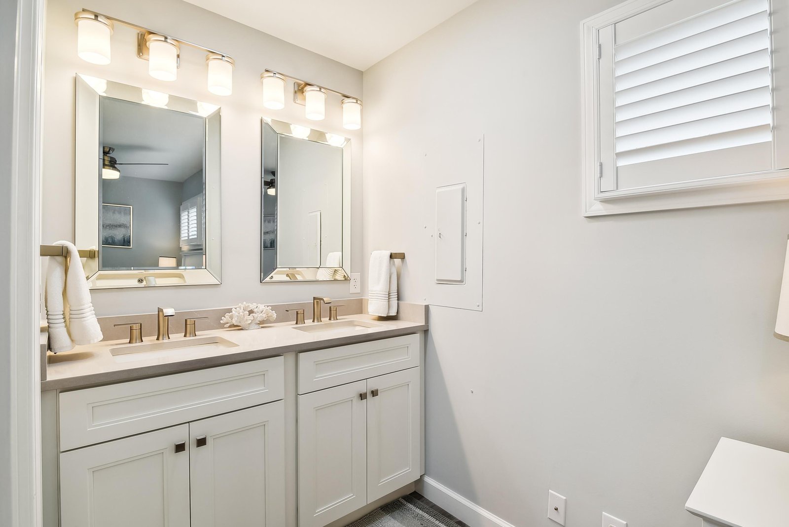 Step into your bright, freshly styled bathroom with a spacious double vanity and soft lighting to help you start every morning refreshed.