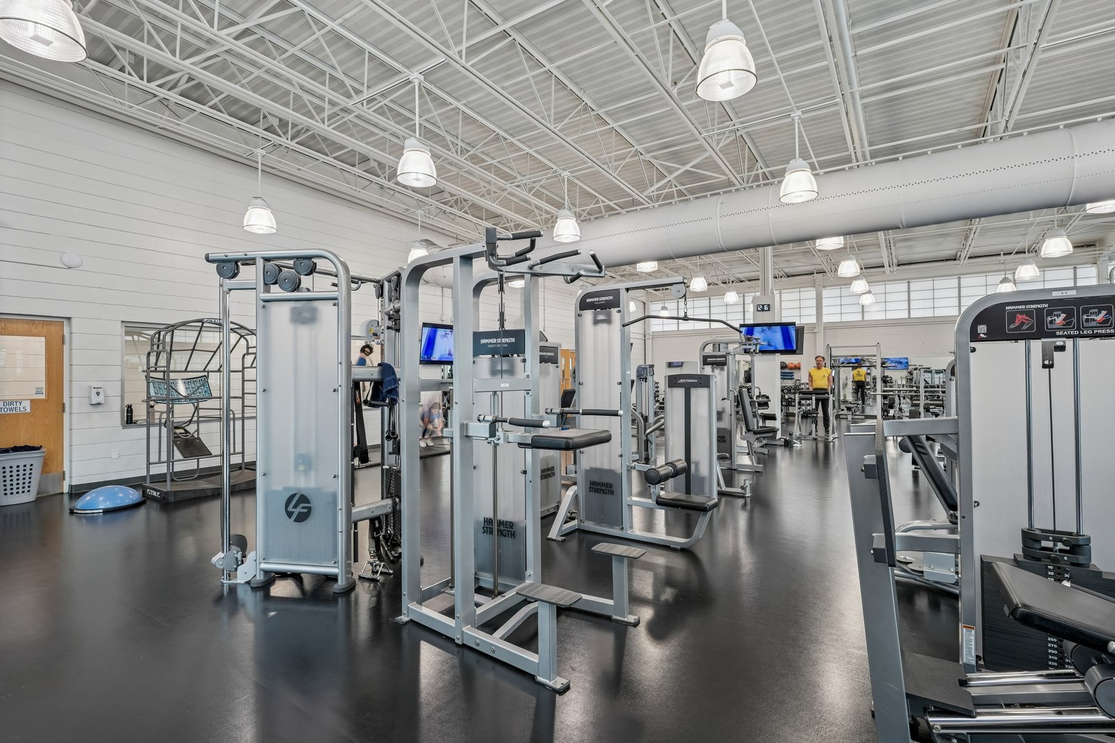 Stay on track with your fitness goals in this fully-equipped modern gym featuring state-of-the-art cardio and strength training equipment.