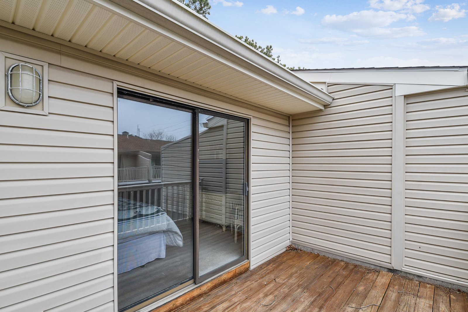 Your private balcony opens to a serene sky and peaceful neighborhood, offering a cozy spot to unwind with morning coffee or evening conversation.