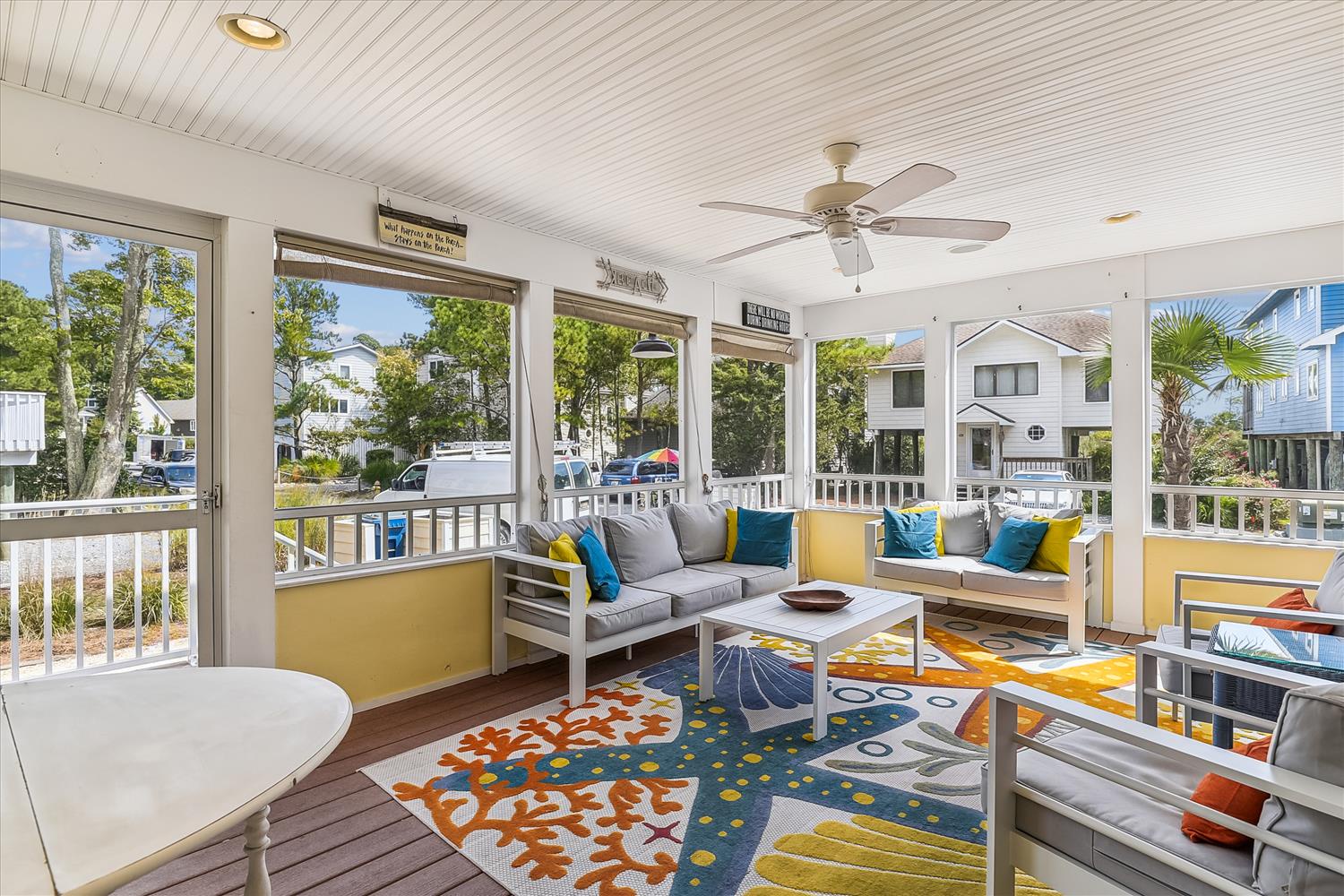 Settle into the cheerful screened porch where a gentle breeze and colorful cushions await your morning coffee or evening glass of wine.