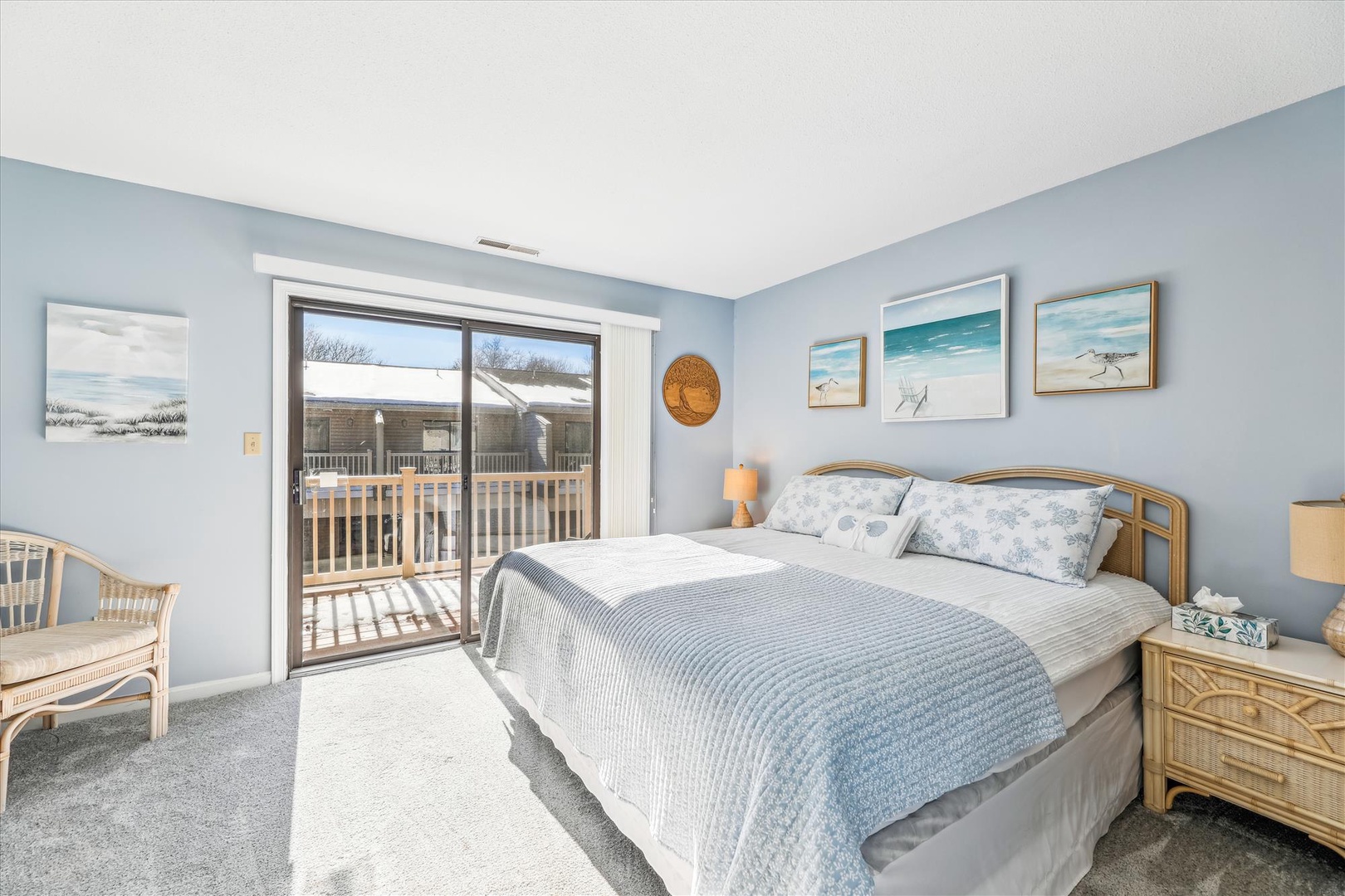 Drift off in this serene coastal-themed bedroom where soft blue walls and beach-inspired art create your perfect retreat. Step onto your private balcony each morning for fresh air and peaceful views.