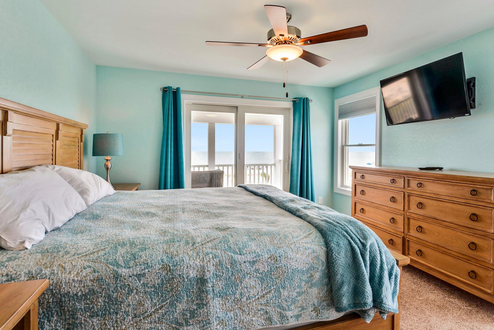 Wake up to coastal breezes and breathtaking ocean views right from your serene bedroom. The calming colors and thoughtful touches create the perfect retreat after sunny beach days.