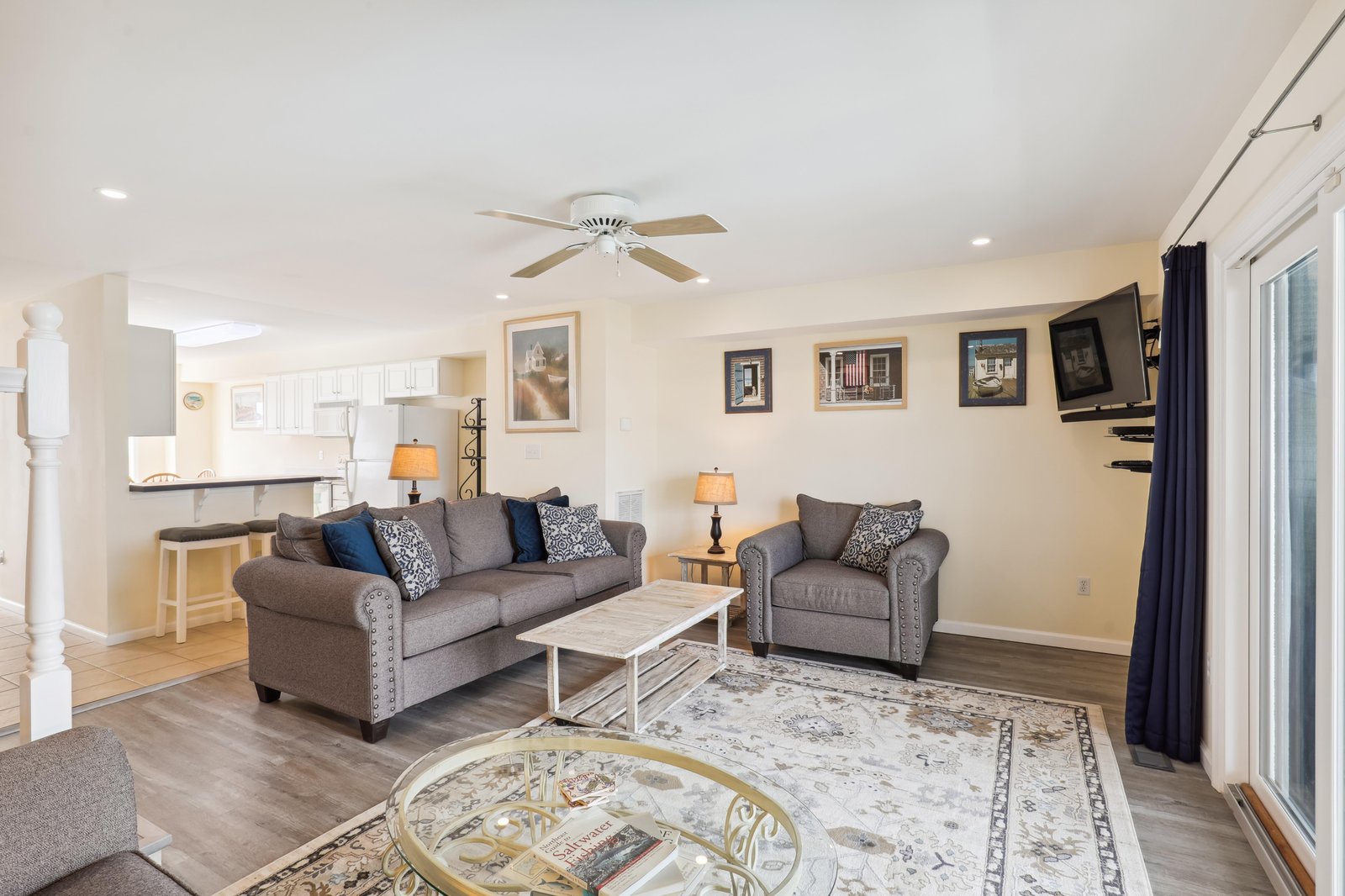 Your bright, open living space welcomes you with cozy seating, soft lighting, and a ceiling fan to keep you comfortable—perfect for unwinding after a day of adventure.