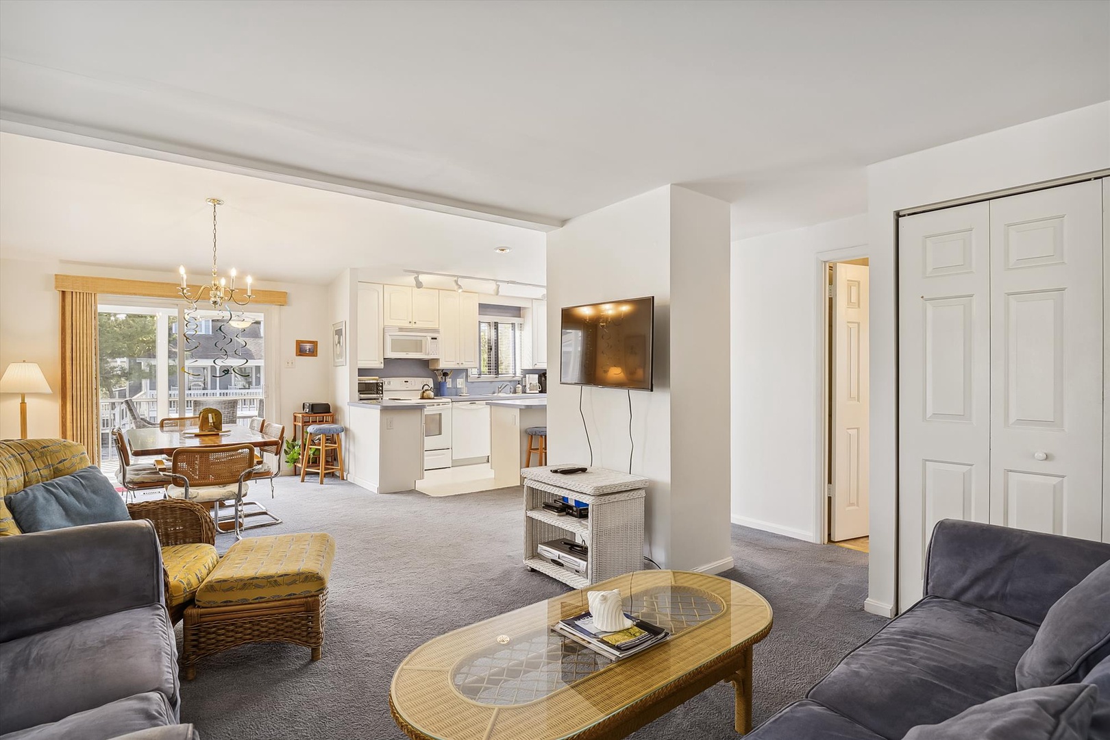 Relax in this bright, open living space with plush seating, a fully equipped kitchen, and dining area—perfect for unwinding after your day of adventure.