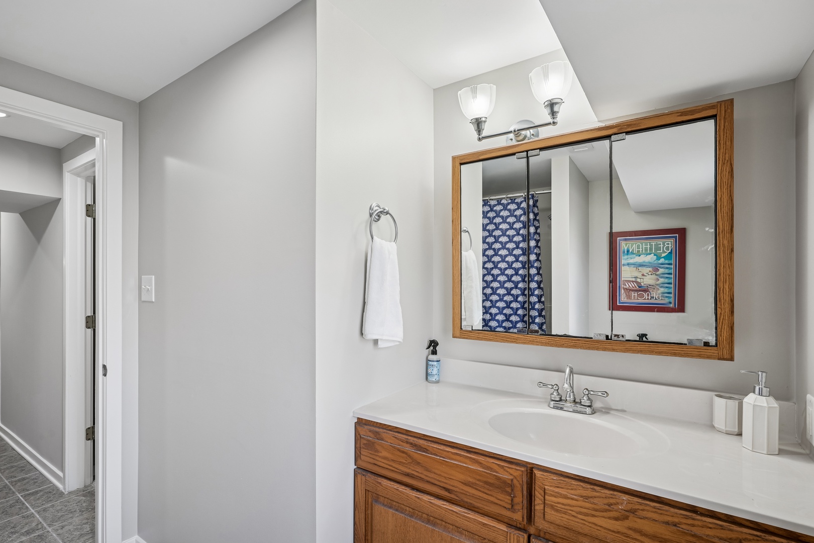 Your spacious bathroom features a large vanity with ample counter space, perfect for getting ready each morning in comfort.