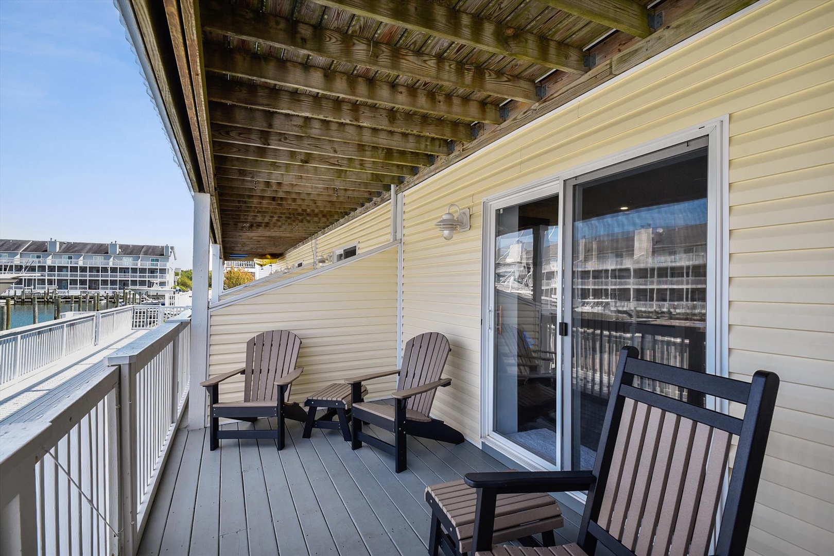 Settle into your private waterfront balcony, where Adirondack chairs and marina views await your morning coffee or evening relaxation.