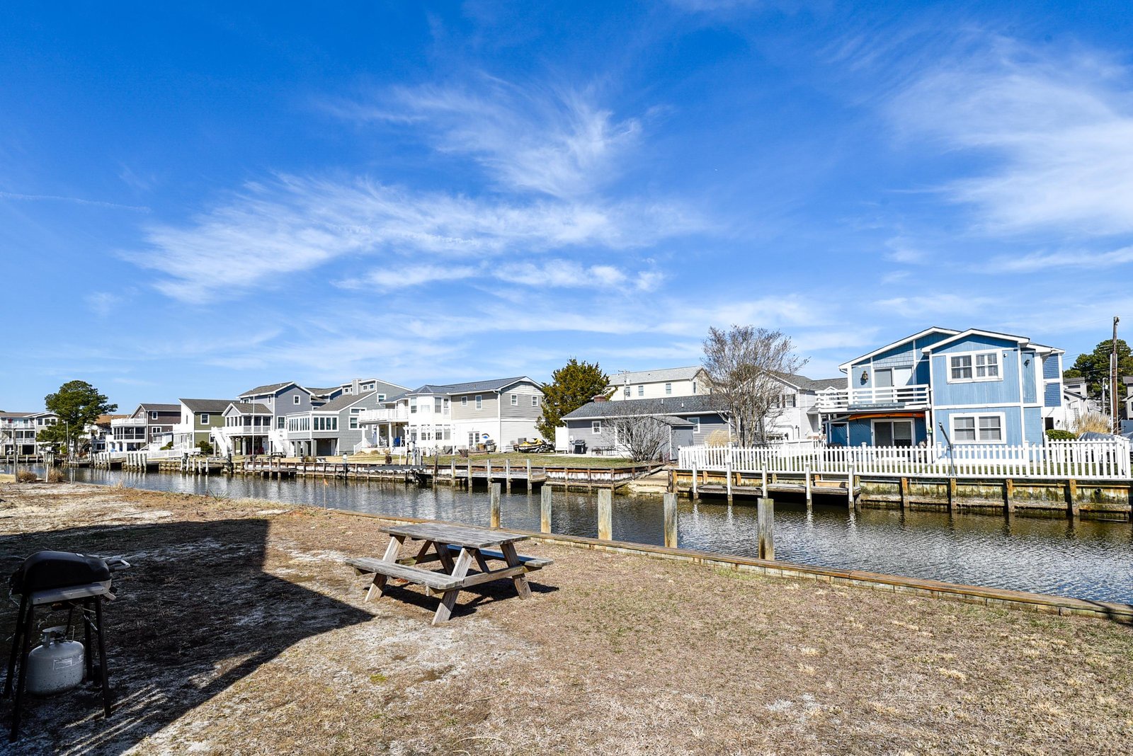 Waterfront neighborhood with private dock access and picnic area perfect for relaxing by the canal.