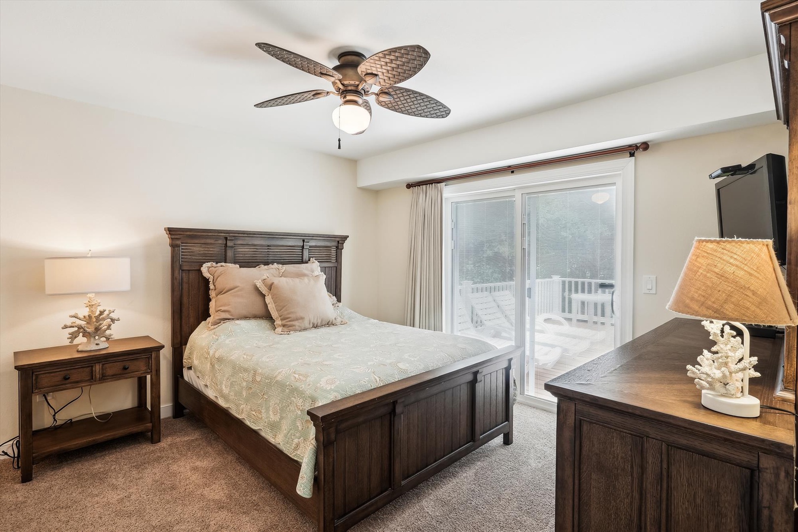 Retreat to your coastal-inspired bedroom with rich wood furnishings, plush bedding, and a private balcony where you can soak in fresh air and natural light.