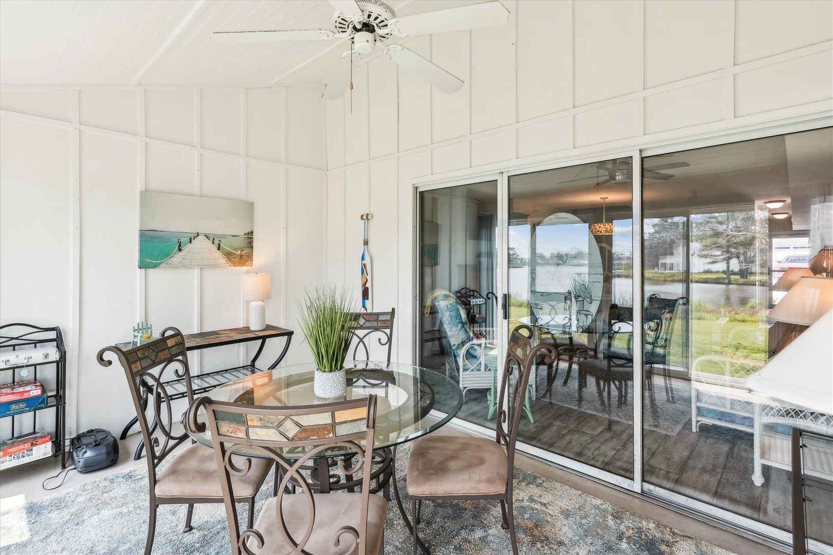 Dine in comfort at your private enclosed patio, where glass doors frame peaceful water views and natural light fills the space. Perfect for morning coffee or evening meals with loved ones.