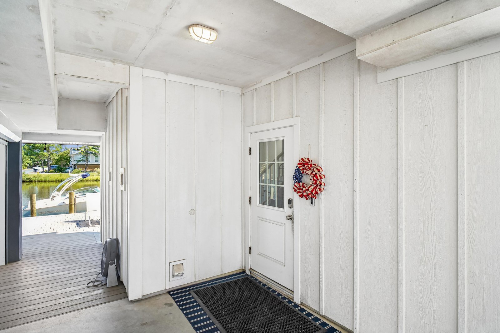 A welcoming entrance with water views and coastal charm, setting the tone for your waterfront retreat.