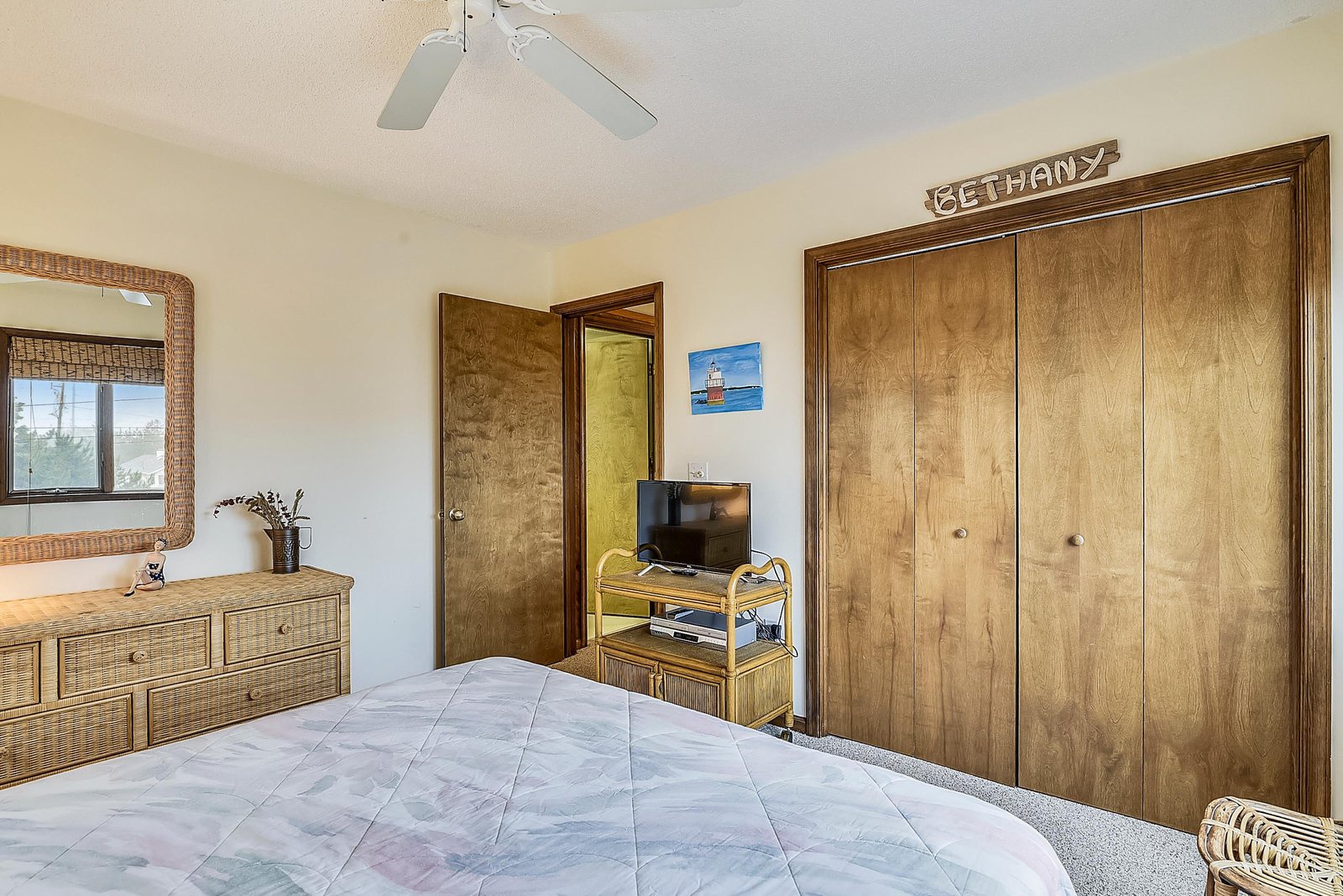 Unwind in your spacious bedroom with natural light, plenty of storage, and a ceiling fan to keep you cool and comfortable.