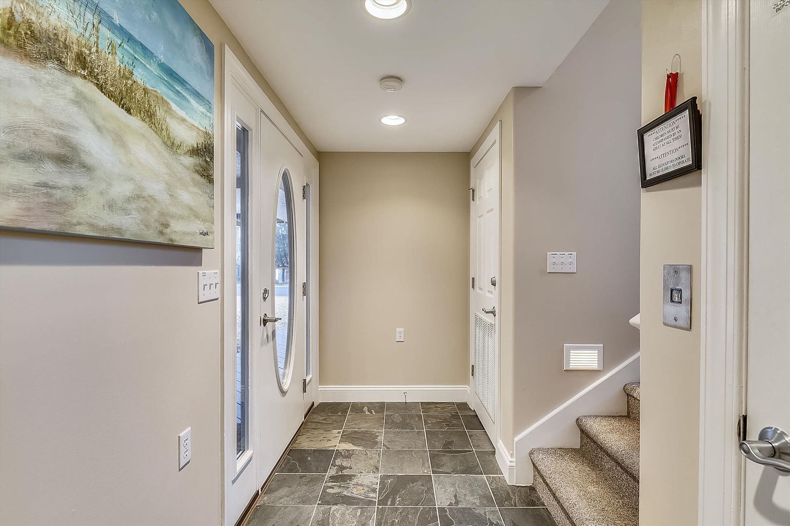 Step inside to your welcoming entryway, where coastal artwork and crisp finishes greet you the moment you arrive. This bright, tiled space leads to all your vacation adventures.