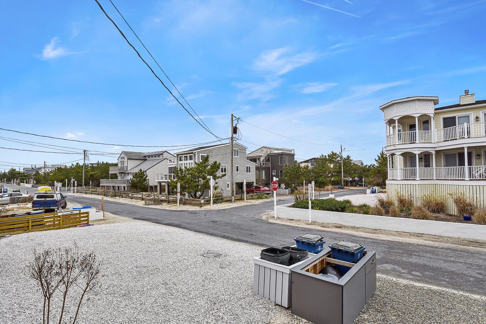 A quiet coastal neighborhood features beachside homes and tree-lined streets, offering a peaceful arrival and convenient access to the surrounding area.
