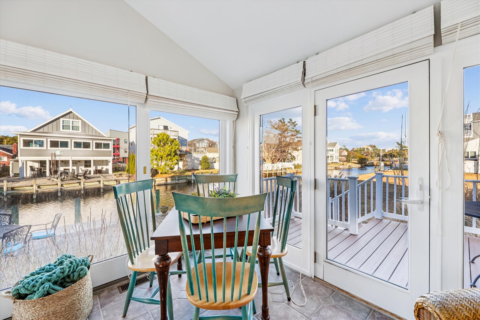 Your private waterfront dining nook offers panoramic marina views through floor-to-ceiling windows, creating the perfect spot for morning coffee or evening meals.