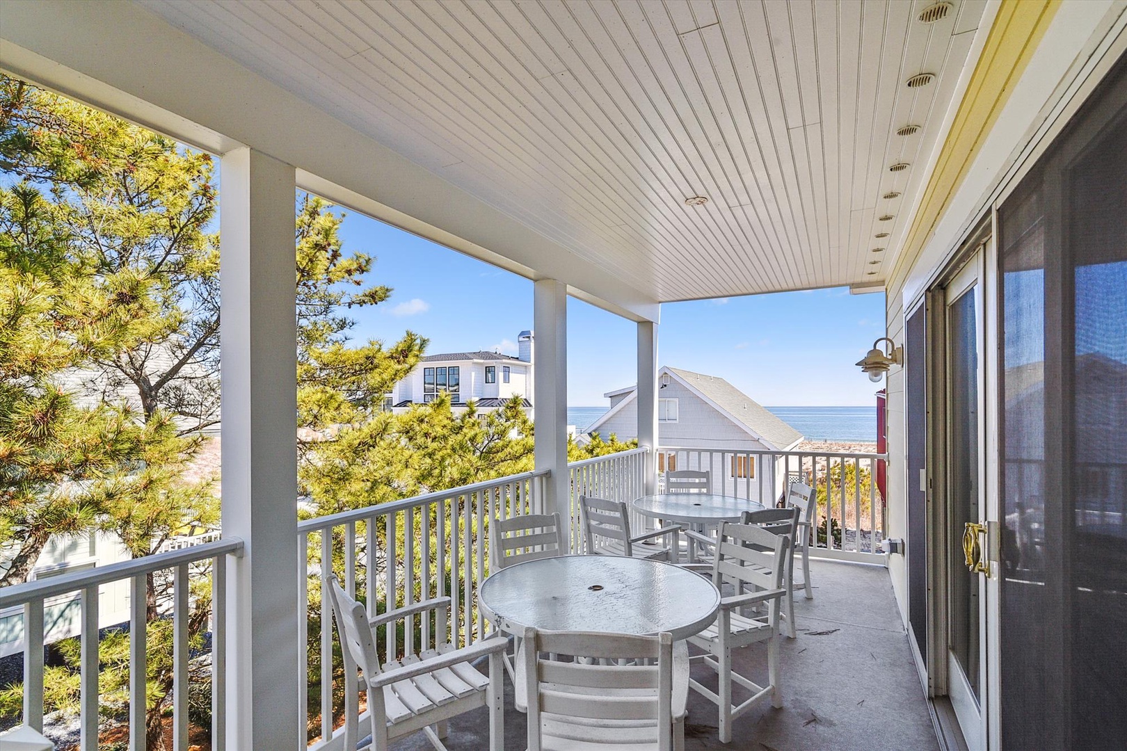 Step onto your private covered terrace and breathe in the fresh coastal air. Relax at the outdoor table, enjoy morning coffee, or unwind as the sea breeze drifts through the pines—your peaceful retreat awaits.