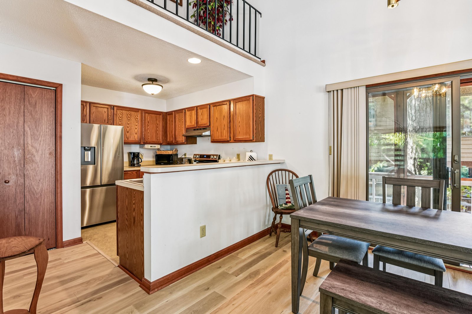 Step into your open-plan retreat with soaring ceilings and natural light streaming through. The fully equipped kitchen and cozy dining space invite you to gather, cook, and relax, while the private balcony beckons for morning coffee or sunset views.