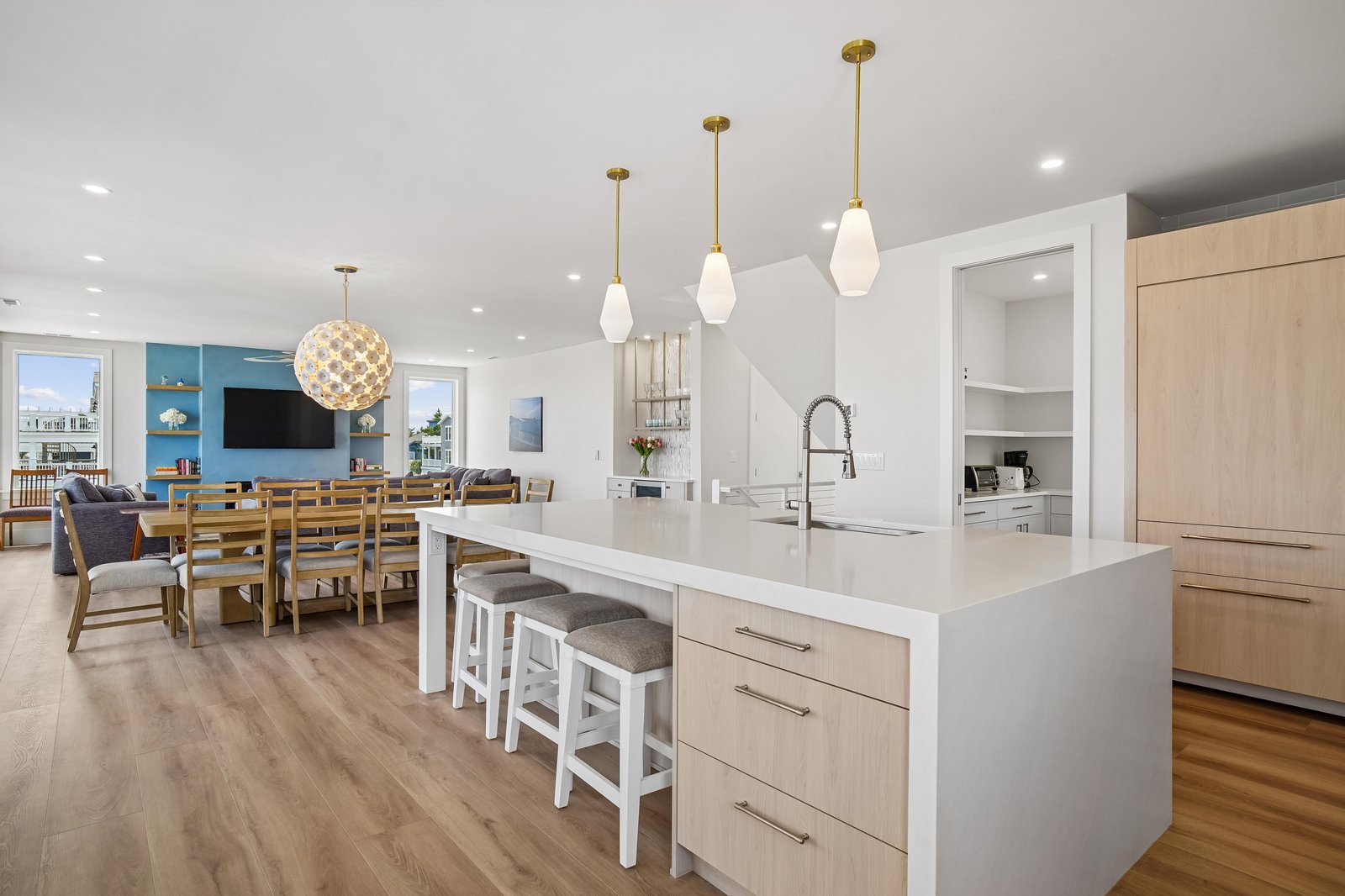 Gather around your spacious island for meals and conversation, with sleek countertops, modern fixtures, and an open flow that connects you to the dining and living areas—perfect for memorable group moments.