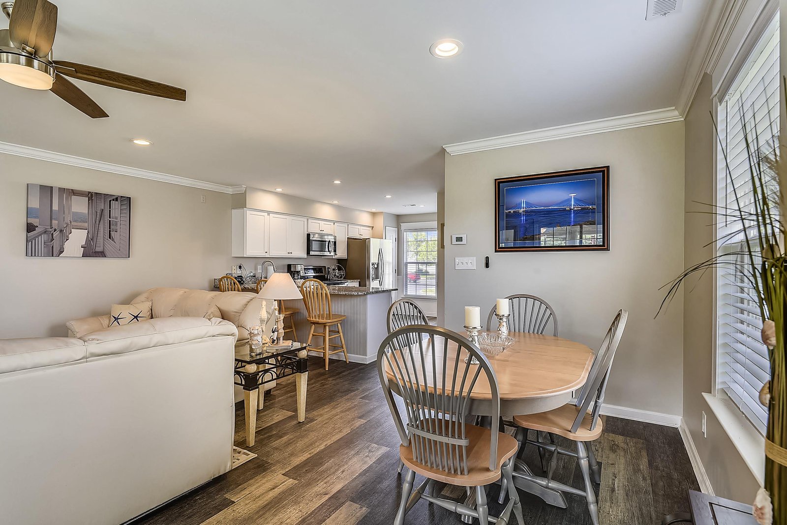 Step into your bright, open living space where coastal comfort meets home. Sink into the plush sofa, gather around the dining table, and feel right at home with a kitchen ready for your culinary adventures.